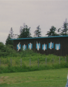 Color photograph of rear wall of theatre; the name "Sea View" is painted in stylized diamonds.